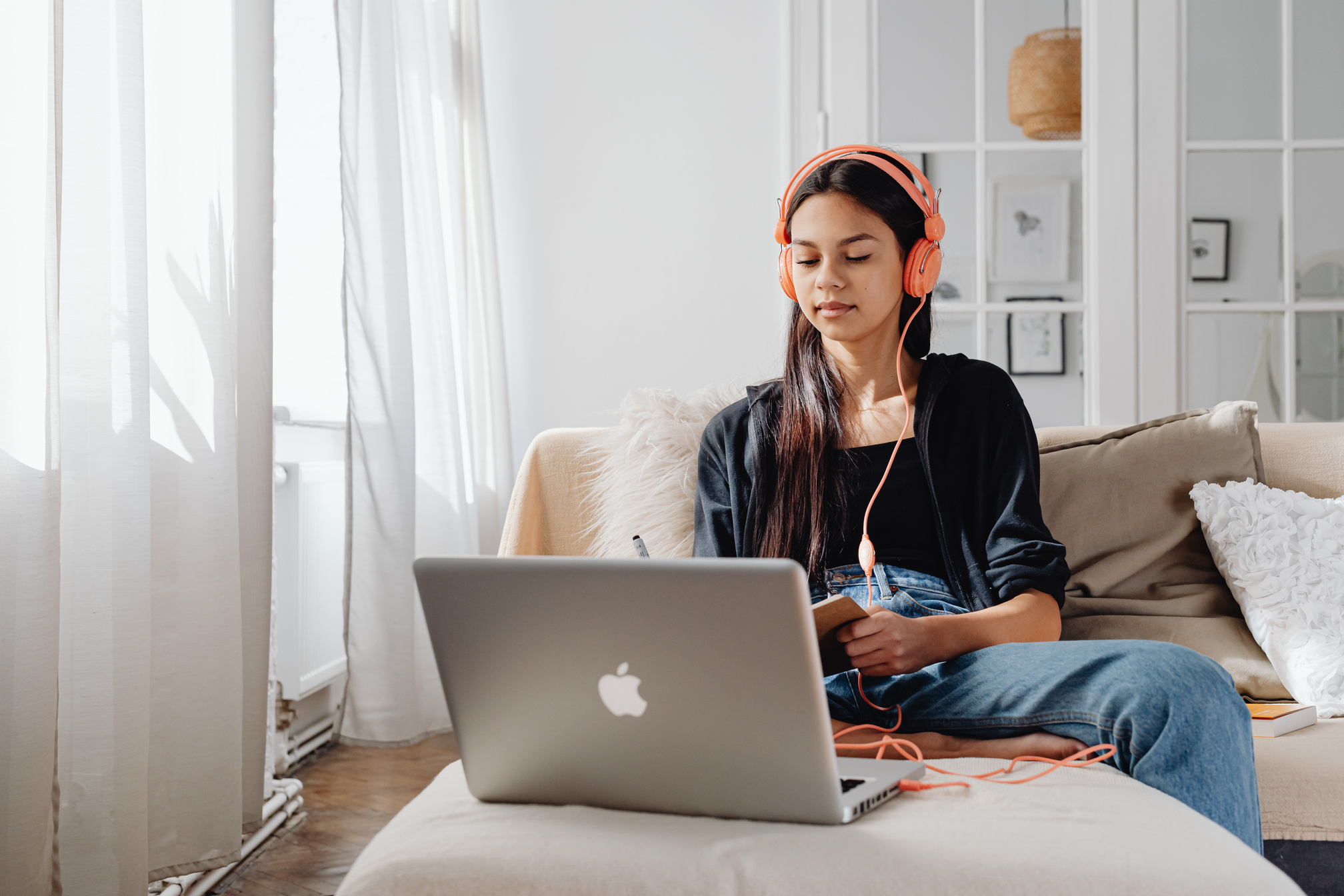 Woman Using a Laptop with Headphones
